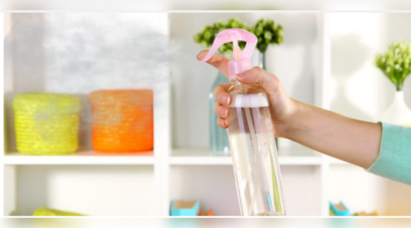 Aerosol air freshener spraying harmful chemicals.