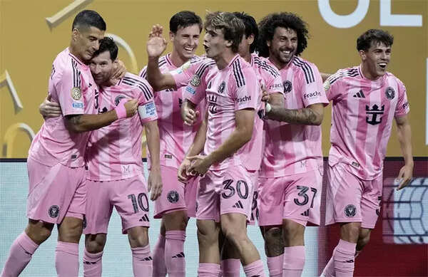 Messi and Suarez celebrate a goal for Inter Miami against Porto.