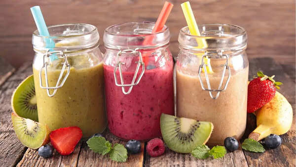 A variety of colorful and healthy smoothies, each with different ingredients and health benefits.